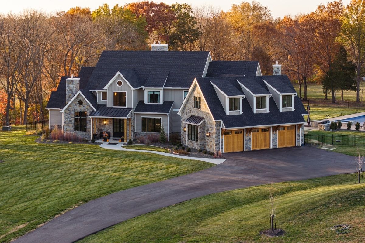 Aerial shot of home surrounded by yard and trees